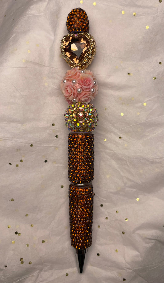 Orange Pen with Pink Flowers and Dazzling Orange Heart at the Top