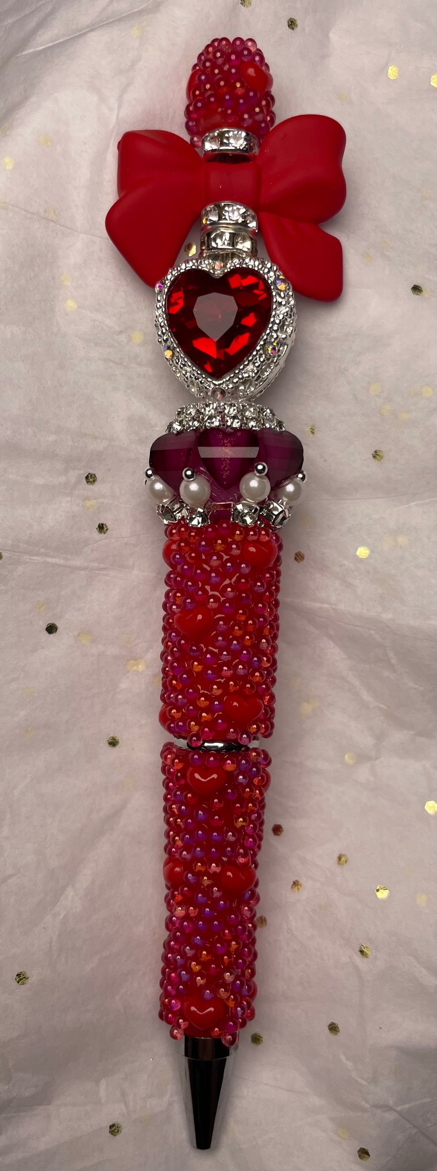 Red Pen with Red Bow and Red Heart at the Top