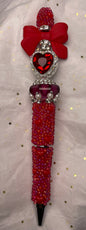 Red Pen with Red Bow and Red Heart at the Top