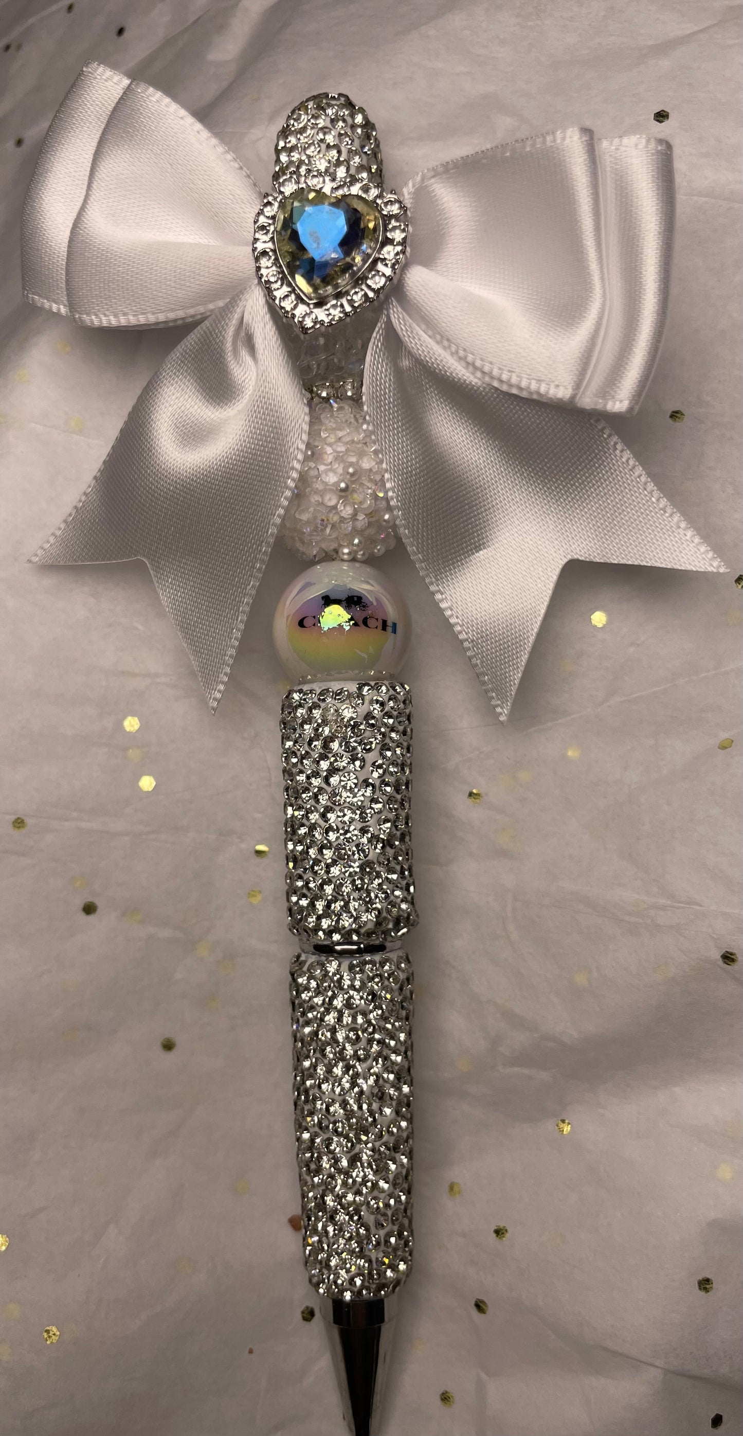 White/Silver Sparkly Pen with White Bow at the top and shiny Blue Heart