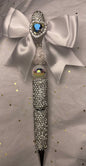 White/Silver Sparkly Pen with White Bow at the top and shiny Blue Heart