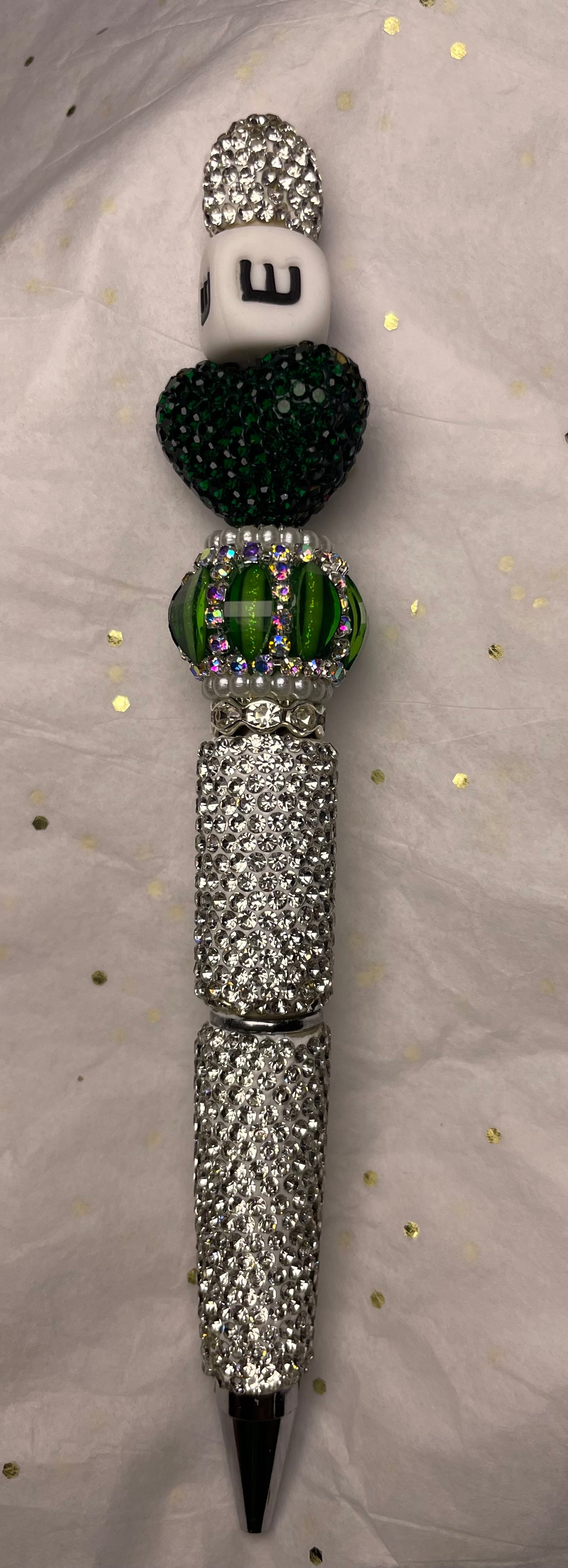 Green and White Pen with Letter "E" and Green Heart at the Top